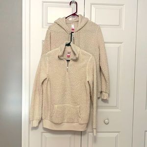 Two Cream Fluffy 100 polyester (Sherpa like) pullovers. Super soft and cozy.
